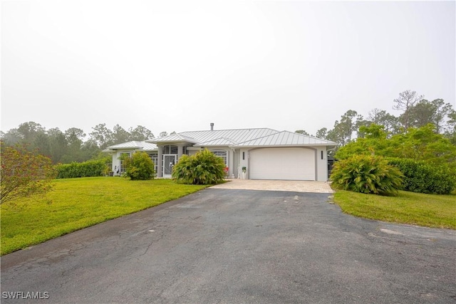 2618 35th Ave NE, Naples, FL 34120 - single story home featuring a front yard, a standing seam roof, a garage, metal roof, and driveway