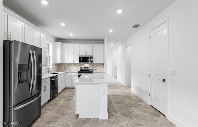 17313 Willow Tree Ln, North Fort Myers, FL 33917 - kitchen with stainless steel appliances, a sink, recessed lighting, light countertops, and tasteful backsplash