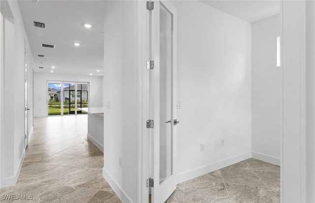 17313 Willow Tree Ln, North Fort Myers, FL 33917 - hallway featuring baseboards and recessed lighting