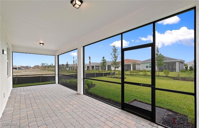 17313 Willow Tree Ln, North Fort Myers, FL 33917 - unfurnished sunroom featuring a residential view
