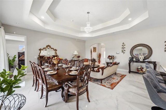 3407 20th St SW, Lehigh Acres, FL 33976 - dining room with a raised ceiling, arched walkways, marble finish floor, and recessed lighting