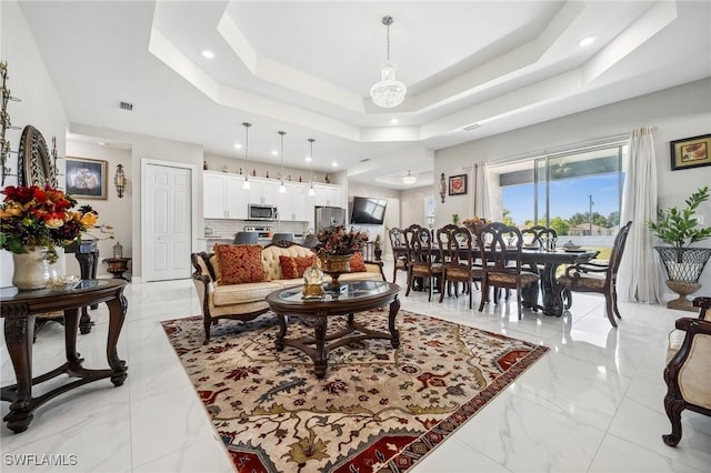 3407 20th St SW, Lehigh Acres, FL 33976 - living area with recessed lighting, marble finish floor, visible vents, and a tray ceiling