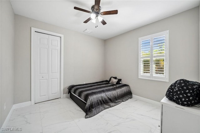 3407 20th St SW, Lehigh Acres, FL 33976 - bedroom featuring a closet, visible vents, marble finish floor, and baseboards