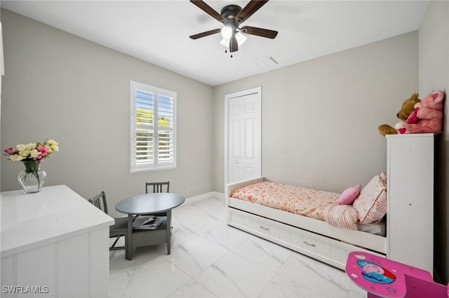 3407 20th St SW, Lehigh Acres, FL 33976 - bedroom featuring a closet, marble finish floor, and ceiling fan