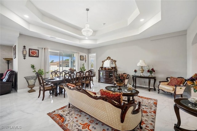 3407 20th St SW, Lehigh Acres, FL 33976 - living room with baseboards, a raised ceiling, marble finish floor, and recessed lighting