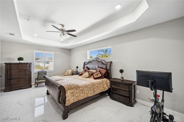 3407 20th St SW, Lehigh Acres, FL 33976 - bedroom with a tray ceiling, a ceiling fan, visible vents, marble finish floor, and baseboards