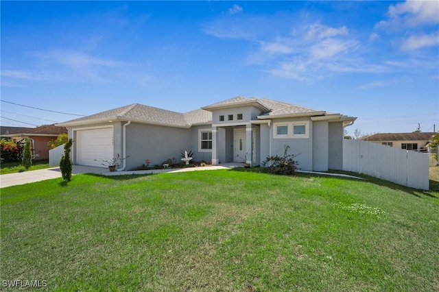 3407 20th St SW, Lehigh Acres, FL 33976 - view of front of property with a garage, a front yard, fence, and stucco siding