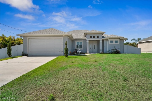 3407 20th St SW, Lehigh Acres, FL 33976 - prairie-style house featuring a front yard, a garage, concrete driveway, fence, and stucco siding