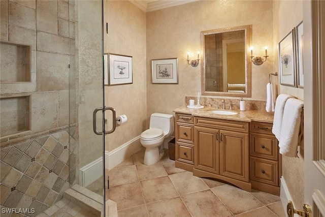 full bathroom with tile patterned floors, toilet, vanity, a shower stall, and ornamental molding