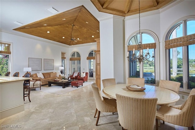 dining area with crown molding, a chandelier, a high ceiling, visible vents, and recessed lighting