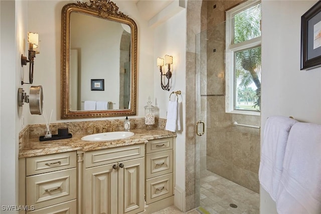 full bath featuring a shower stall and vanity
