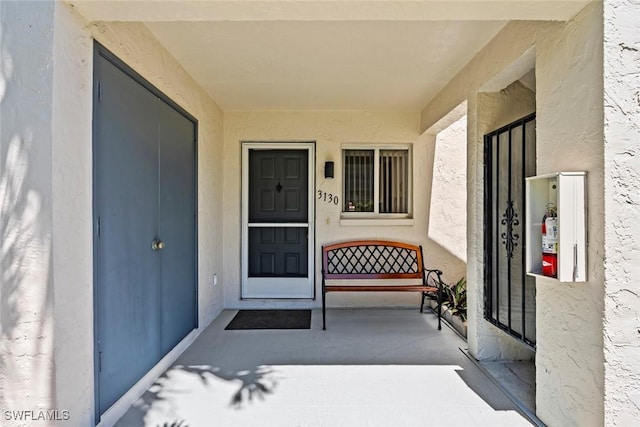 3130 Kings Lake Blvd Unit 7543, Naples, FL 34112 - view of exterior entry featuring stucco siding