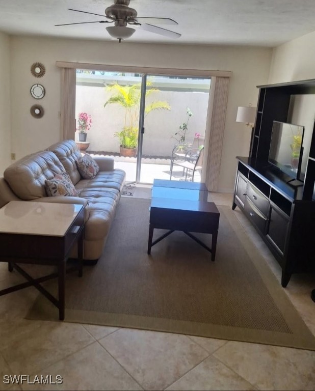 3130 Kings Lake Blvd Unit 7543, Naples, FL 34112 - living room with light tile patterned floors and a ceiling fan