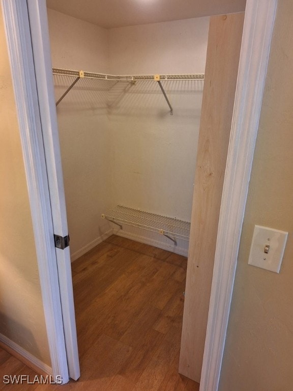 3130 Kings Lake Blvd Unit 7543, Naples, FL 34112 - spacious closet with wood finished floors