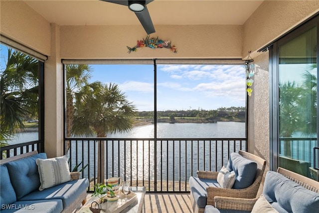 sunroom featuring a water view