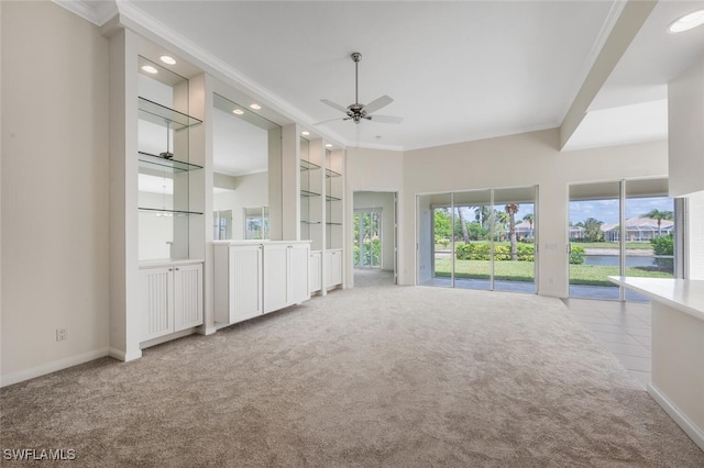 8511 Alessandria Ct, Naples, FL 34114 - unfurnished living room featuring carpet floors, built in shelves, baseboards, ceiling fan, and ornamental molding