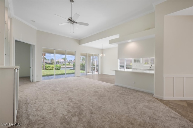 8511 Alessandria Ct, Naples, FL 34114 - unfurnished living room with ornamental molding, a sink, ceiling fan, and carpet
