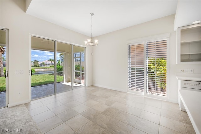 8511 Alessandria Ct, Naples, FL 34114 - unfurnished dining area with light tile patterned floors, a notable chandelier, and baseboards