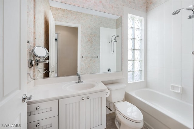 8511 Alessandria Ct, Naples, FL 34114 - bathroom featuring wallpapered walls, plenty of natural light, toilet, and vanity