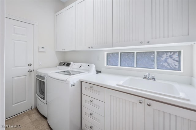 8511 Alessandria Ct, Naples, FL 34114 - laundry area with independent washer and dryer, a sink, cabinet space, and light tile patterned flooring