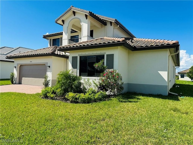 5048 Gambero Way, Ave Maria, FL 34142 - exterior space featuring a balcony, stucco siding, an attached garage, a tile roof, and a lawn