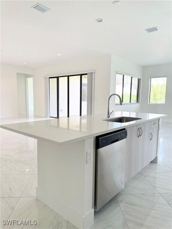 5048 Gambero Way, Ave Maria, FL 34142 - kitchen featuring a sink, open floor plan, stainless steel dishwasher, and marble finish floor