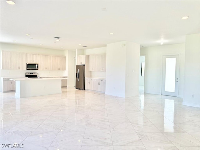 5048 Gambero Way, Ave Maria, FL 34142 - unfurnished living room with recessed lighting, marble finish floor, and baseboards