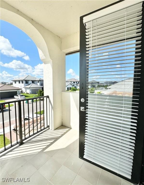 5048 Gambero Way, Ave Maria, FL 34142 - balcony featuring a residential view