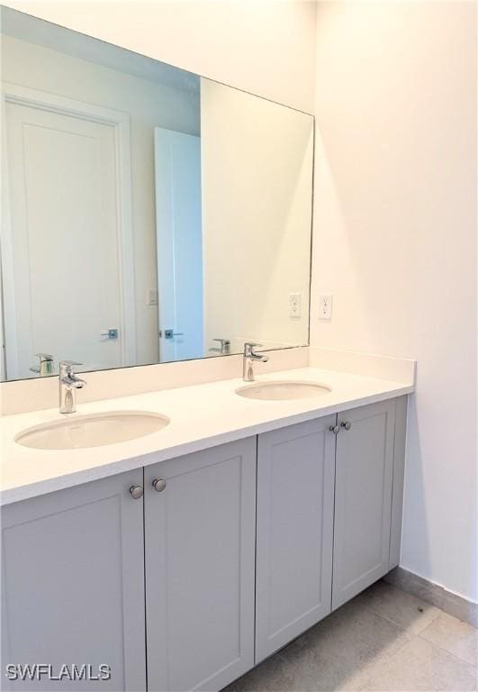 5048 Gambero Way, Ave Maria, FL 34142 - bathroom with double vanity, a sink, and baseboards