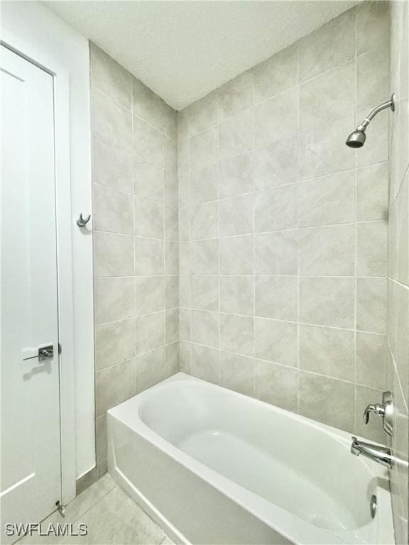 5048 Gambero Way, Ave Maria, FL 34142 - bathroom featuring tile patterned flooring and shower / bath combination