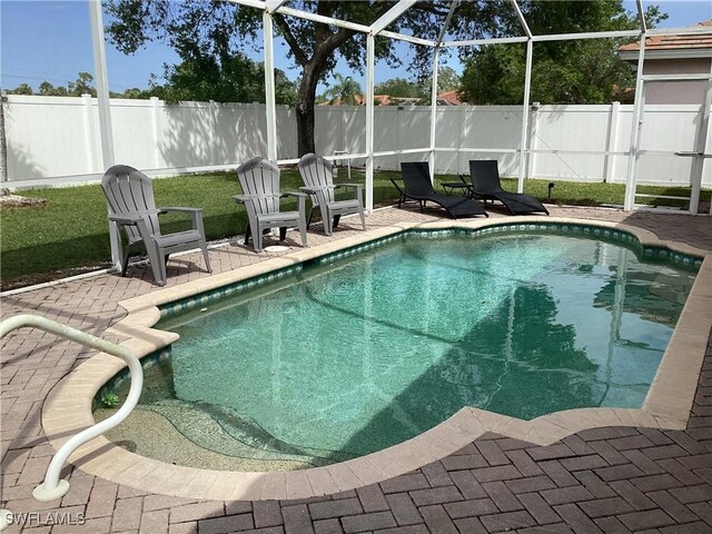 2939 Orange Grove Trl, Naples, FL 34120 - view of swimming pool featuring a patio and a lanai