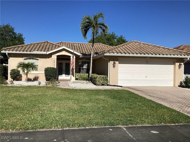 2939 Orange Grove Trl, Naples, FL 34120 - view of front facade featuring french doors, a garage, driveway, a front lawn, and stucco siding