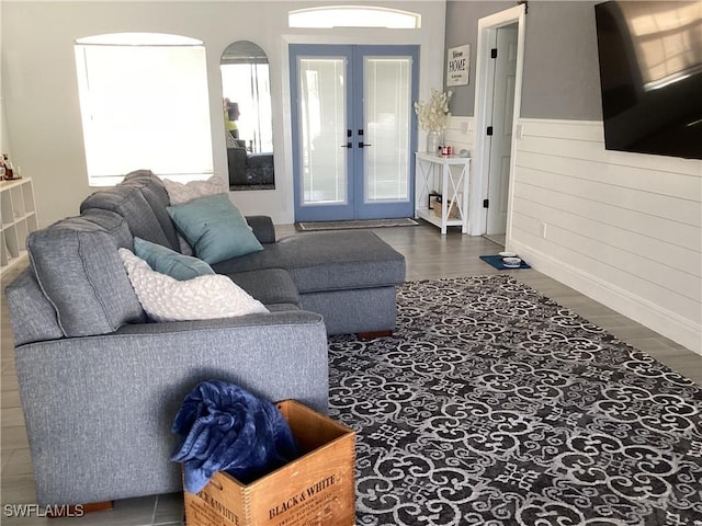 2939 Orange Grove Trl, Naples, FL 34120 - living area featuring wood finished floors, french doors, plenty of natural light, and wainscoting