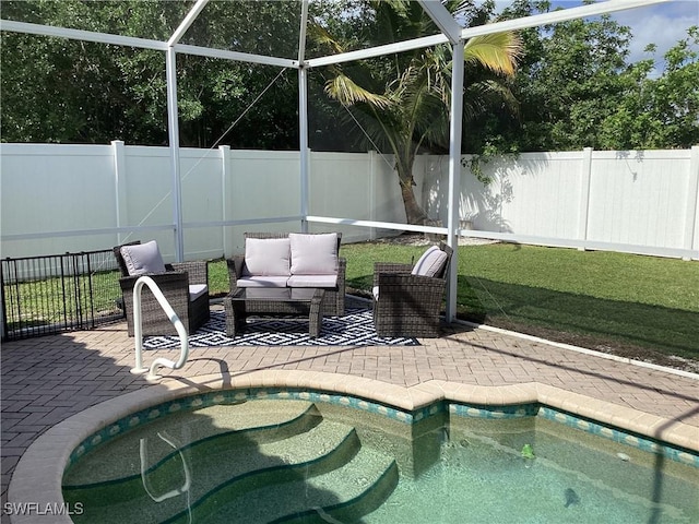 2939 Orange Grove Trl, Naples, FL 34120 - view of swimming pool featuring a fenced backyard, a patio, outdoor lounge area, and glass enclosure