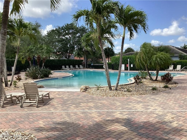 2939 Orange Grove Trl, Naples, FL 34120 - community pool featuring a patio area and fence