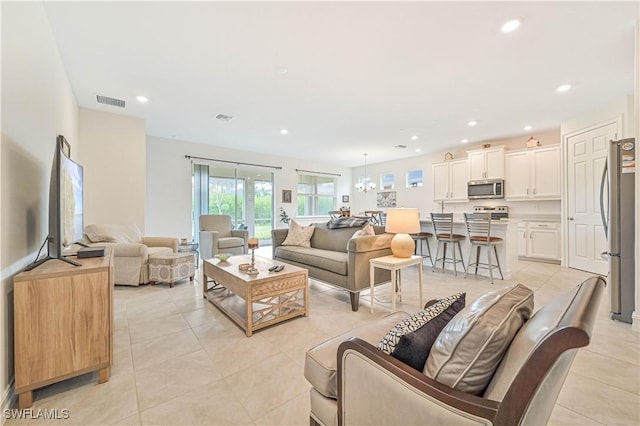 2916 Royal Gardens Ave, Fort Myers, FL 33916 - living area with light tile patterned floors, visible vents, and recessed lighting
