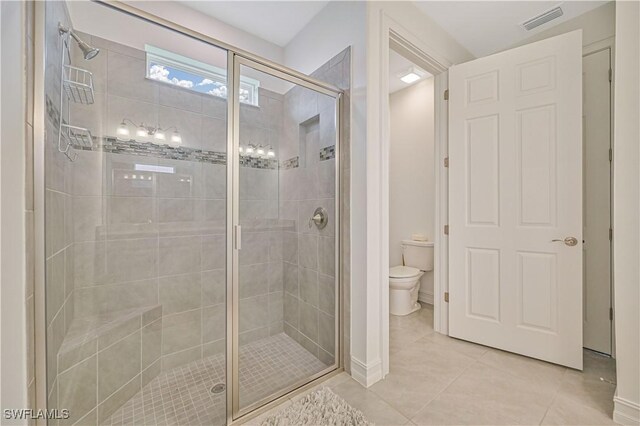 2916 Royal Gardens Ave, Fort Myers, FL 33916 - bathroom featuring a shower stall, tile patterned floors, visible vents, and toilet