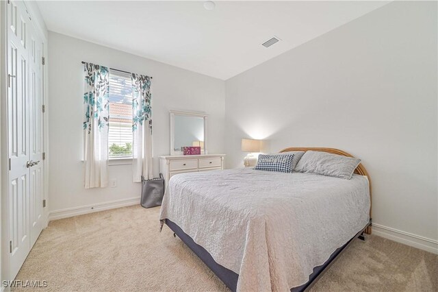 2916 Royal Gardens Ave, Fort Myers, FL 33916 - bedroom with light carpet, baseboards, and visible vents