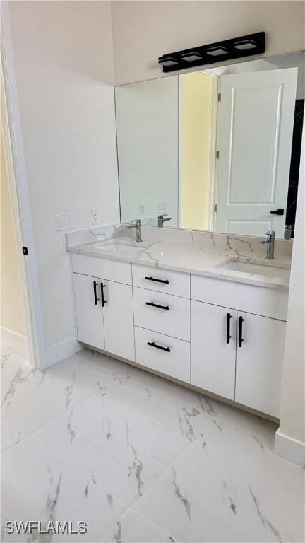 4800 Nora Ave N, Lehigh Acres, FL 33971 - full bathroom featuring double vanity and marble finish floors