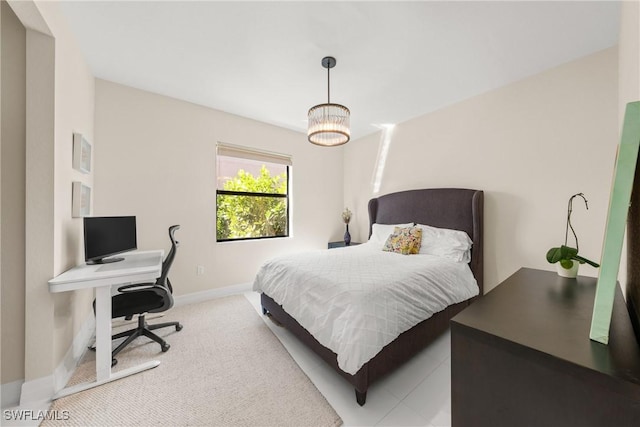 carpeted bedroom featuring baseboards