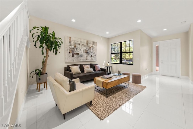 living room with light tile patterned floors, baseboards, and recessed lighting