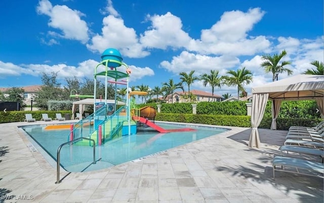 community playground featuring a gazebo and a patio area