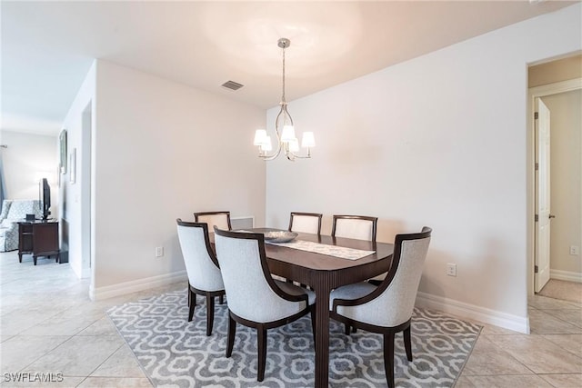 10870 Maitland Way, Fort Myers, FL 33913 - dining area featuring a chandelier, light tile patterned floors, and baseboards