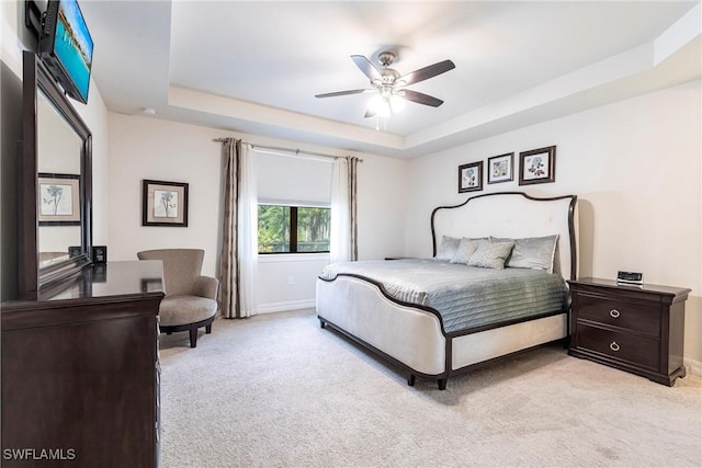 10870 Maitland Way, Fort Myers, FL 33913 - bedroom featuring light colored carpet, a raised ceiling, baseboards, and ceiling fan