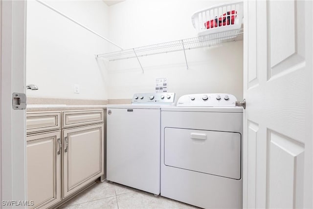 10870 Maitland Way, Fort Myers, FL 33913 - laundry room with separate washer and dryer, cabinet space, and light tile patterned flooring
