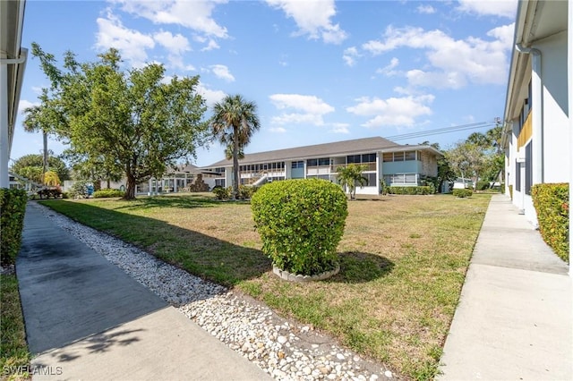 402 SE 42nd Ter Unit D 5, Cape Coral, FL 33904 - view of front facade featuring stucco siding and a front lawn