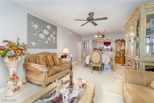 402 SE 42nd Ter Unit D 5, Cape Coral, FL 33904 - living room with ceiling fan with notable chandelier, baseboards, and visible vents