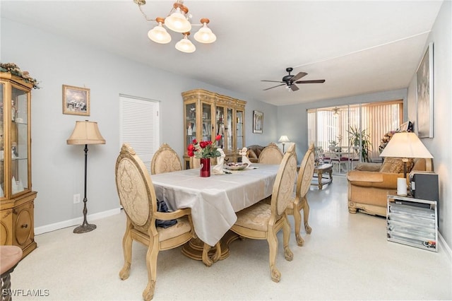 402 SE 42nd Ter Unit D 5, Cape Coral, FL 33904 - dining room with ceiling fan with notable chandelier and baseboards