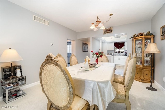 402 SE 42nd Ter Unit D 5, Cape Coral, FL 33904 - dining area with baseboards, visible vents, an inviting chandelier, and plenty of natural light