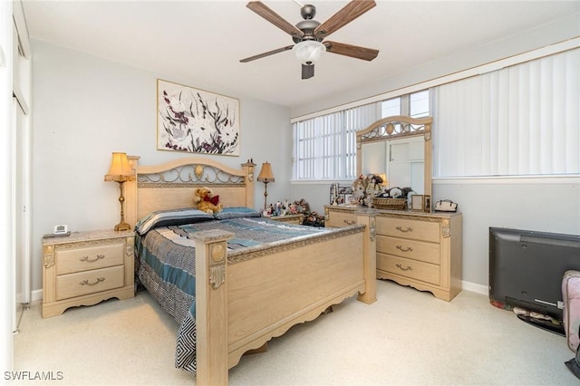 402 SE 42nd Ter Unit D 5, Cape Coral, FL 33904 - bedroom with baseboards, a ceiling fan, and light colored carpet